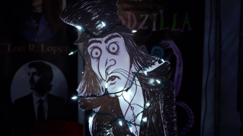 Mister Snark Lurking Wrapped In Christmas Lights